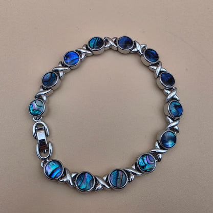 New Zealand Paua Shell/Silvertone XOXO Design 8" Bracelet