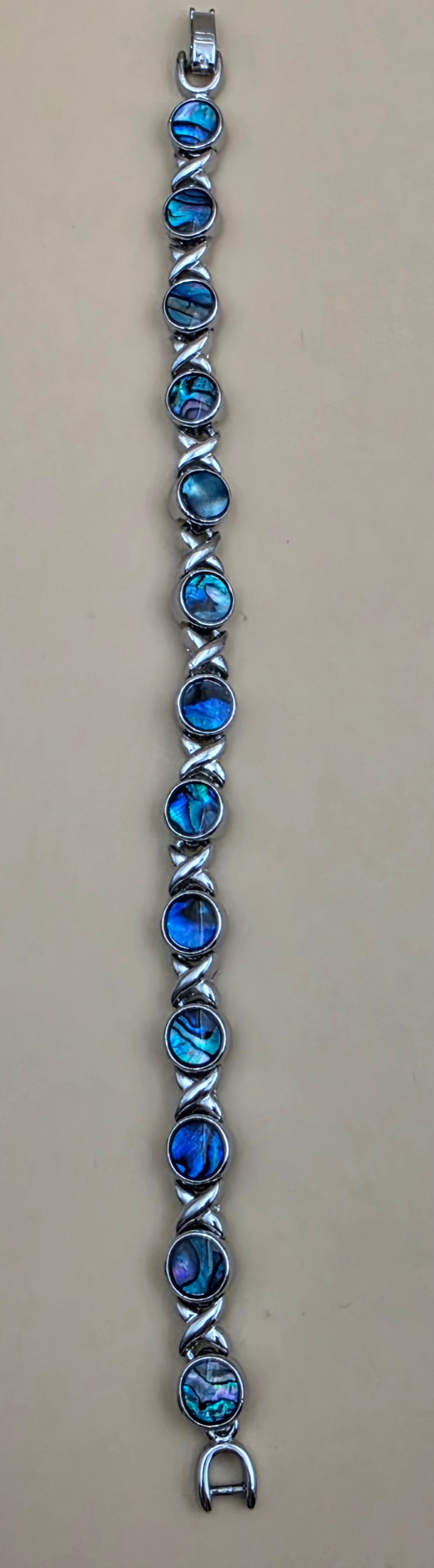 New Zealand Paua Shell/Silvertone XOXO Design 8" Bracelet