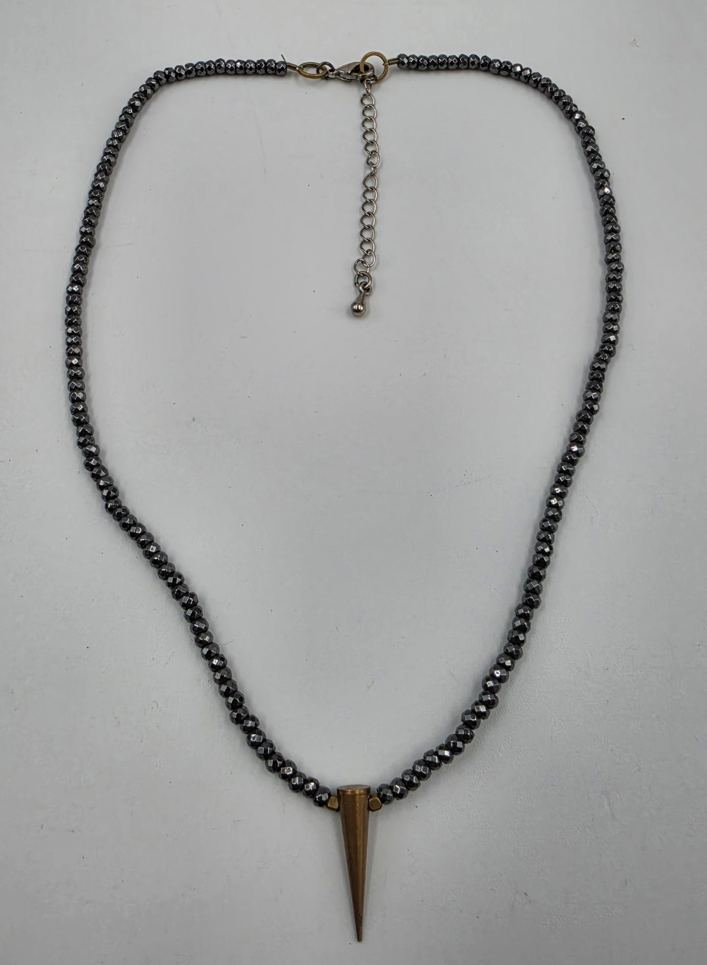 15"-18" Faceted Hematite Bead with Brass Spike Pendant