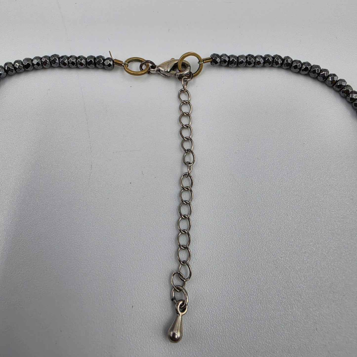 15"-18" Faceted Hematite Bead with Brass Spike Pendant