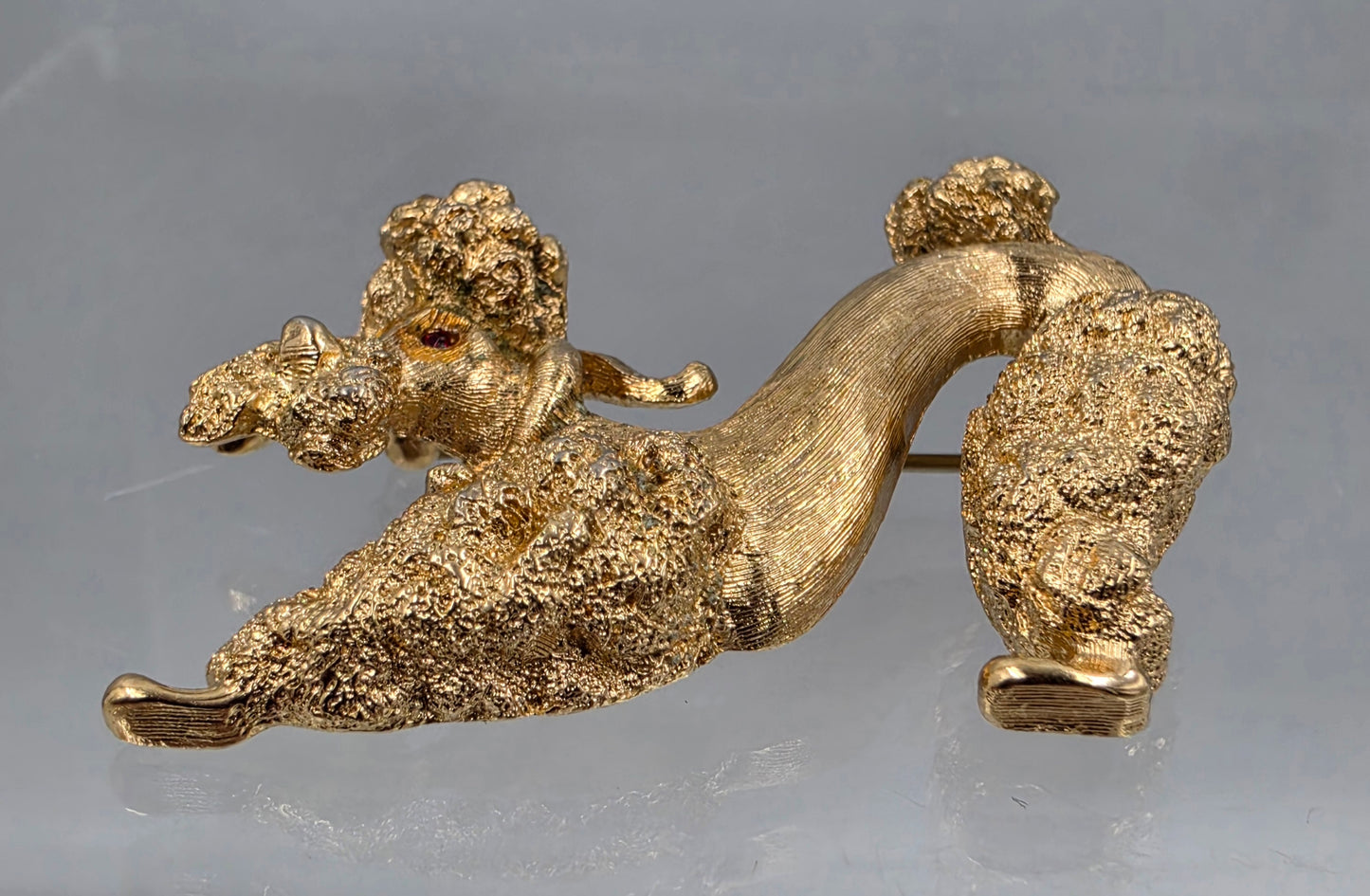 MONET 1.5" Vintage 1960"s-70"s Gold Tone Plated Textured Kneeling Poodle With Red Glass Rhinestone Eyes