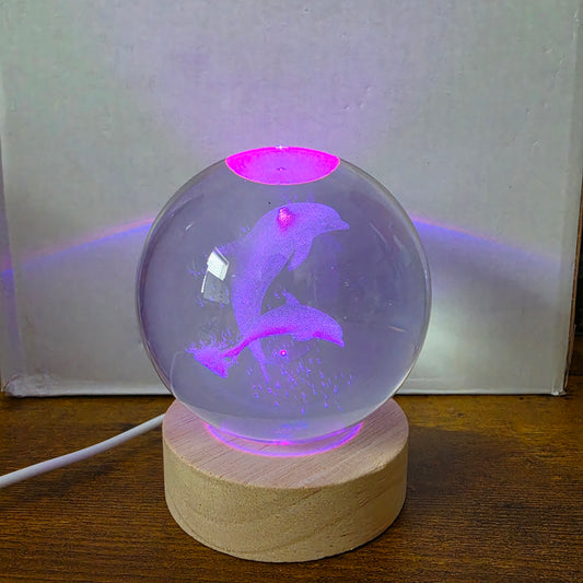 3D Laser Etched Jumping Dolphins Crystal Ball On A Wooden LED Base With Alternating Colors