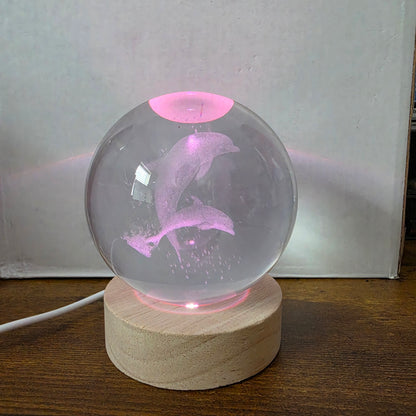 3D Laser Etched Jumping Dolphins Crystal Ball On A Wooden LED Base With Alternating Colors