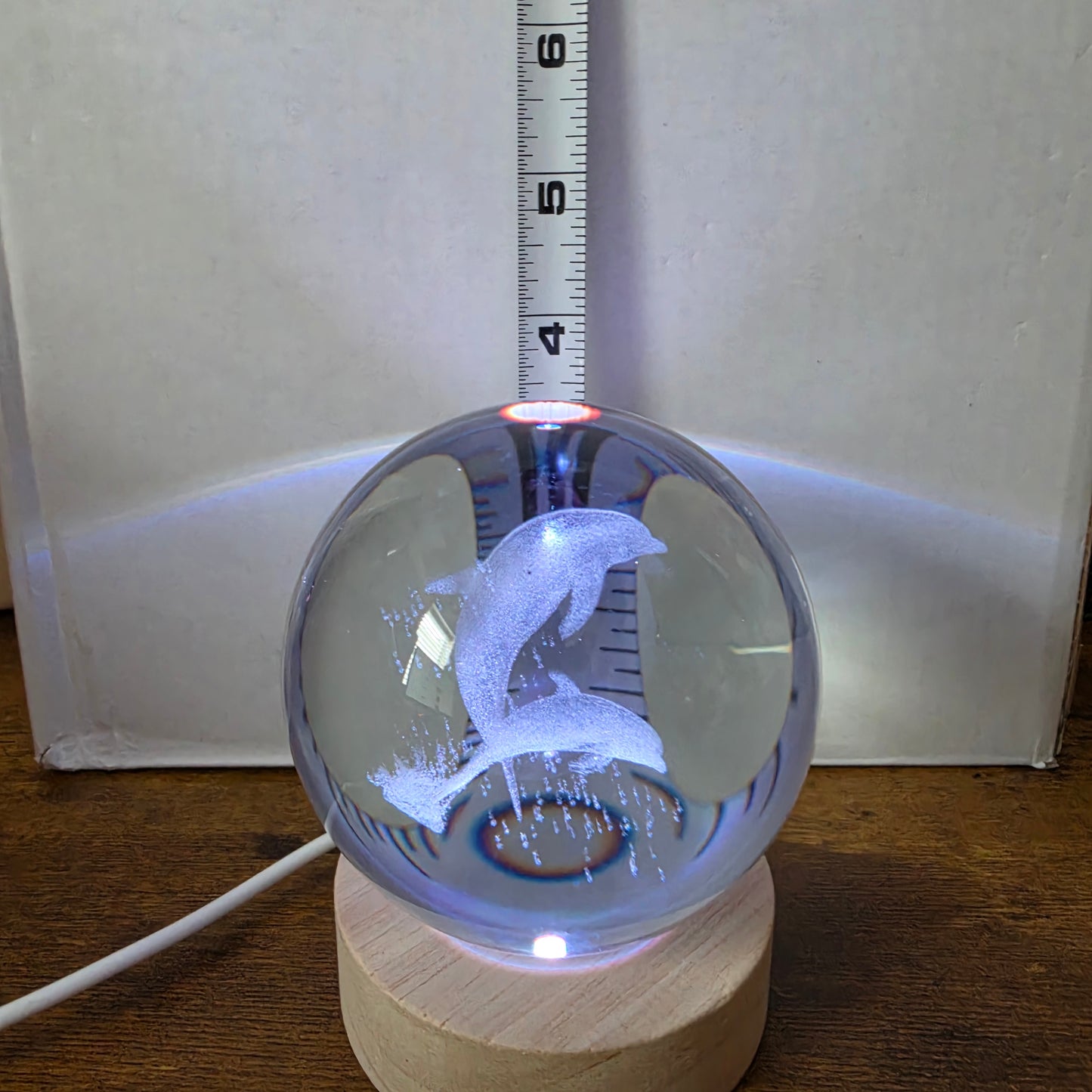 3D Laser Etched Jumping Dolphins Crystal Ball On A Wooden LED Base With Alternating Colors
