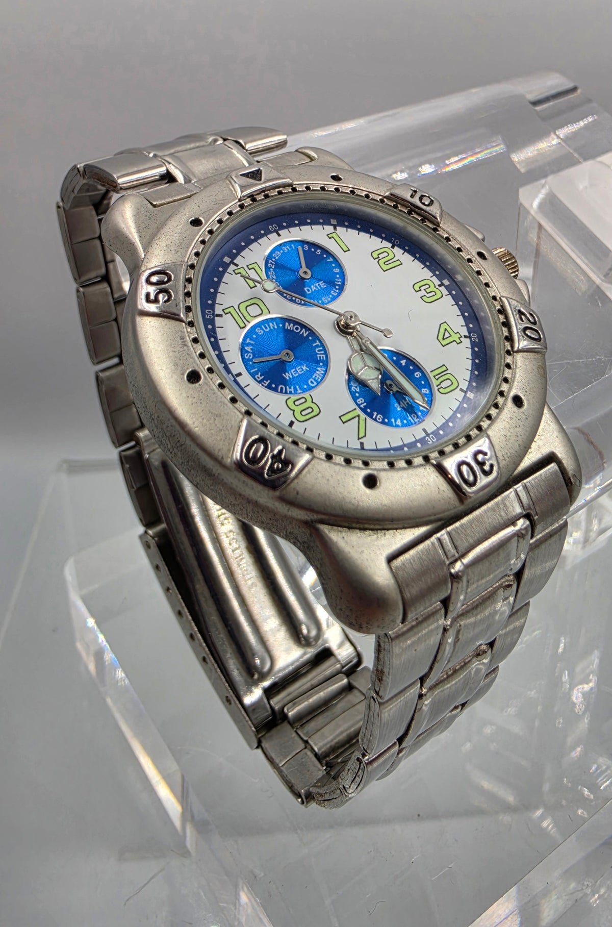 7" Silver Tone Blue Dial Day/Date/Seconds Hand Watch