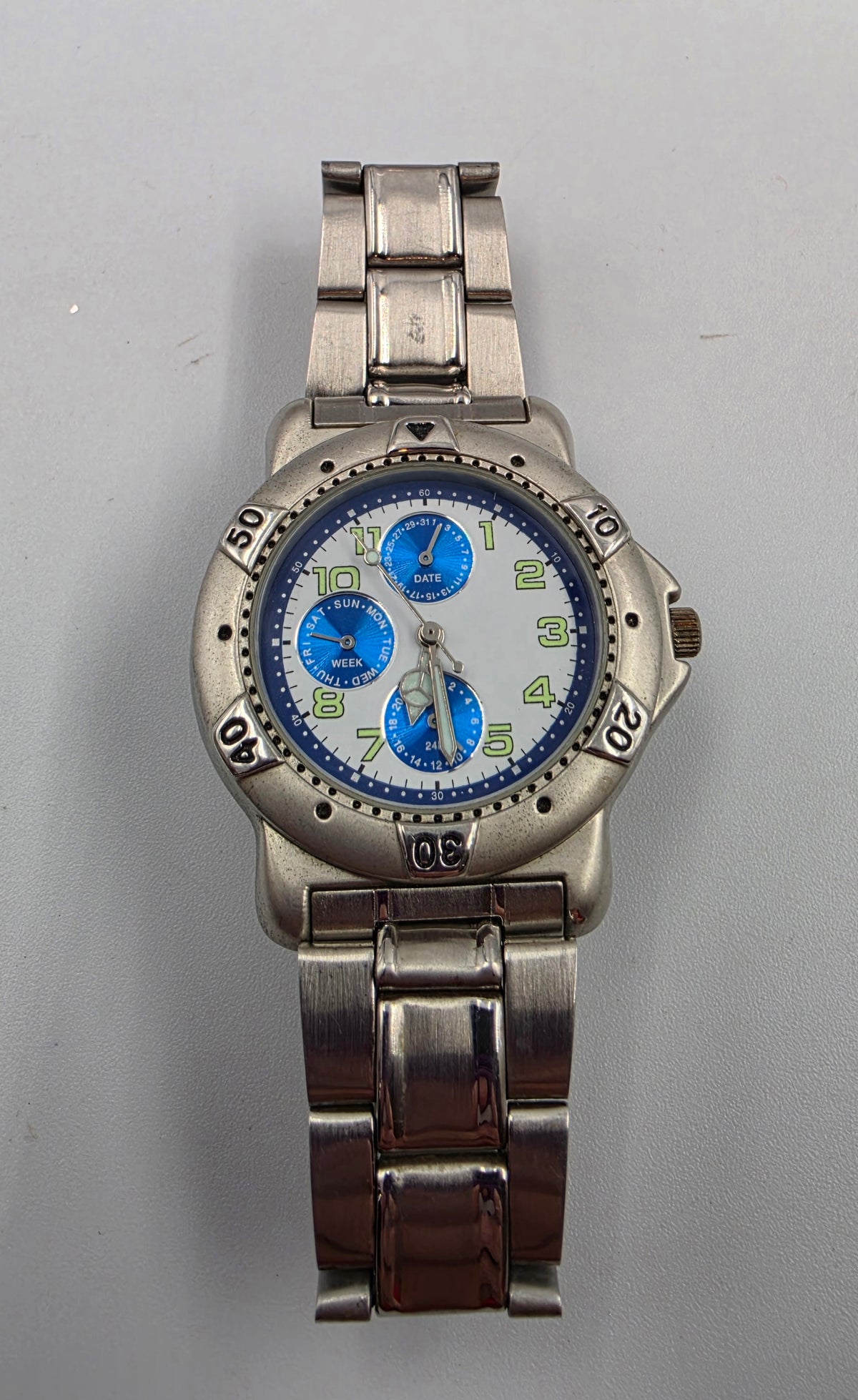 7" Silver Tone Blue Dial Day/Date/Seconds Hand Watch